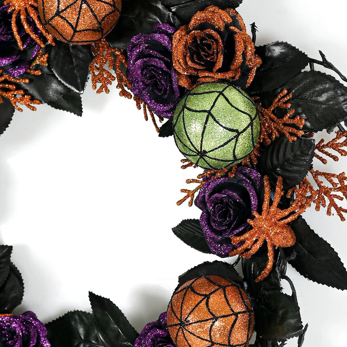 Close-up of detail artificial halloween pumpkin rose spider wreath