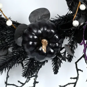 Close-up of pumpkin artificial halloween skeleton wreath