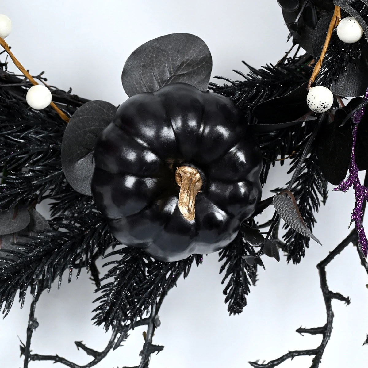 Close-up of pumpkin artificial halloween skeleton wreath