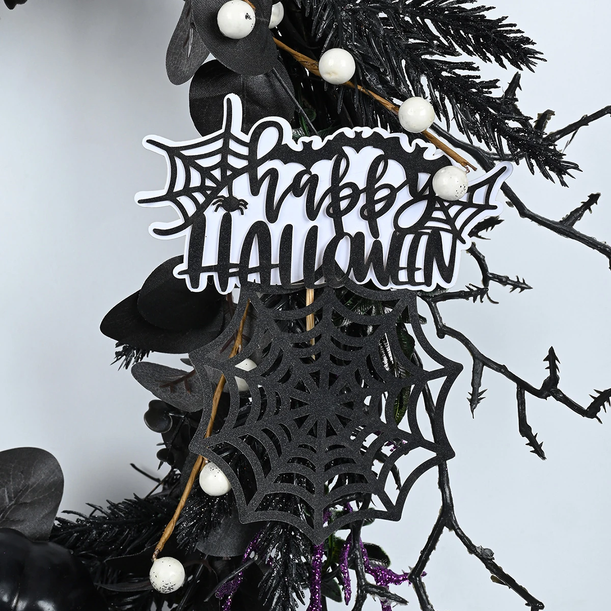 Close-up of sign artificial halloween skeleton wreath