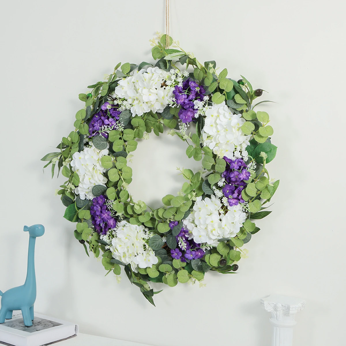 Artificial Hydrangea Eucalyptus Wreath shown in a decorative display
