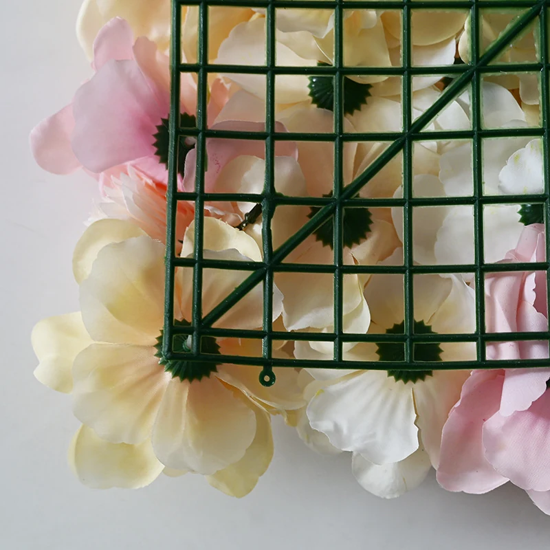 Close-up of grid backing detail for artificial hydrangea and rose flower wall panel