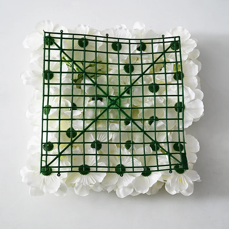 Close-up of white grid backing for artificial hydrangea and rose flower wall panel
