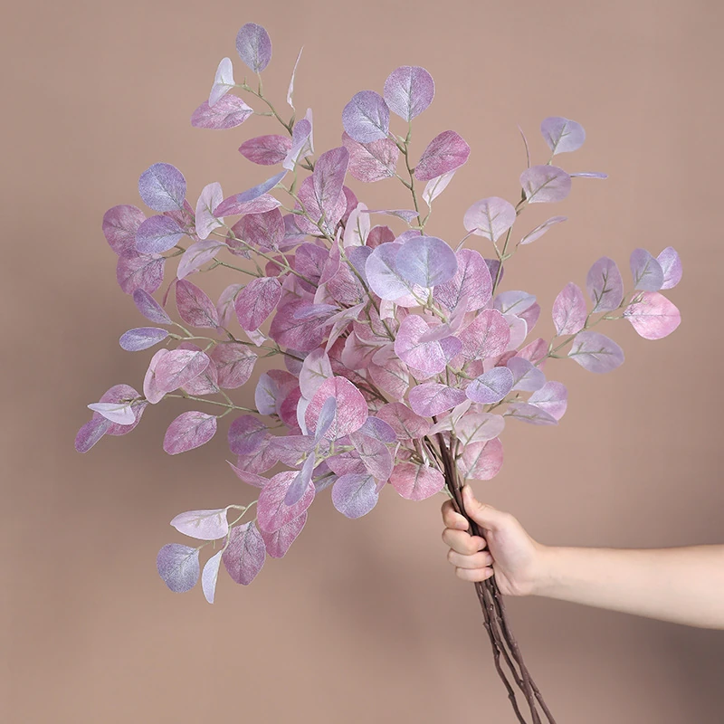 Artificial Iridescent Eucalyptus Spray displayed for bouquet