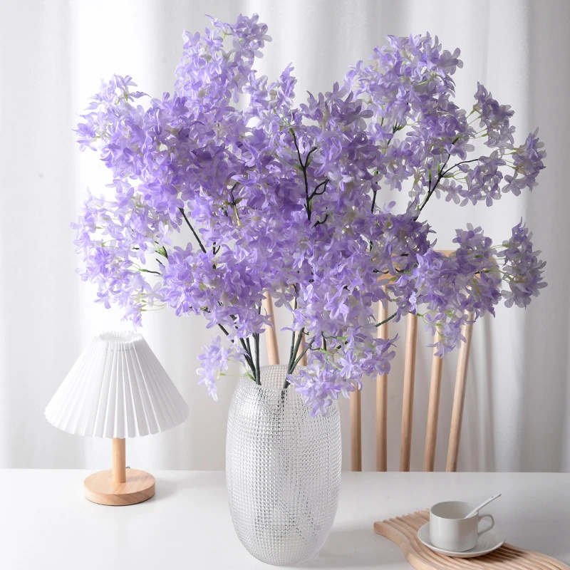 Application display of purple artificial larkspur spray