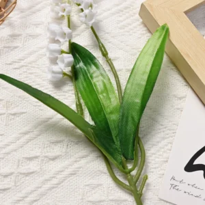 Close-up of green leaves on an artificial lily of the valley stem