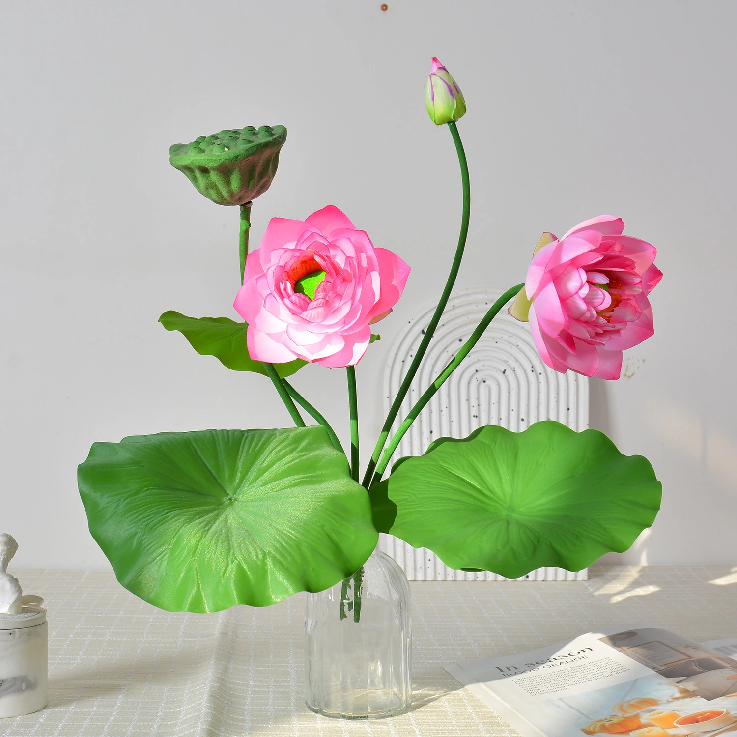 Application display of pink artificial lotus flower bush
