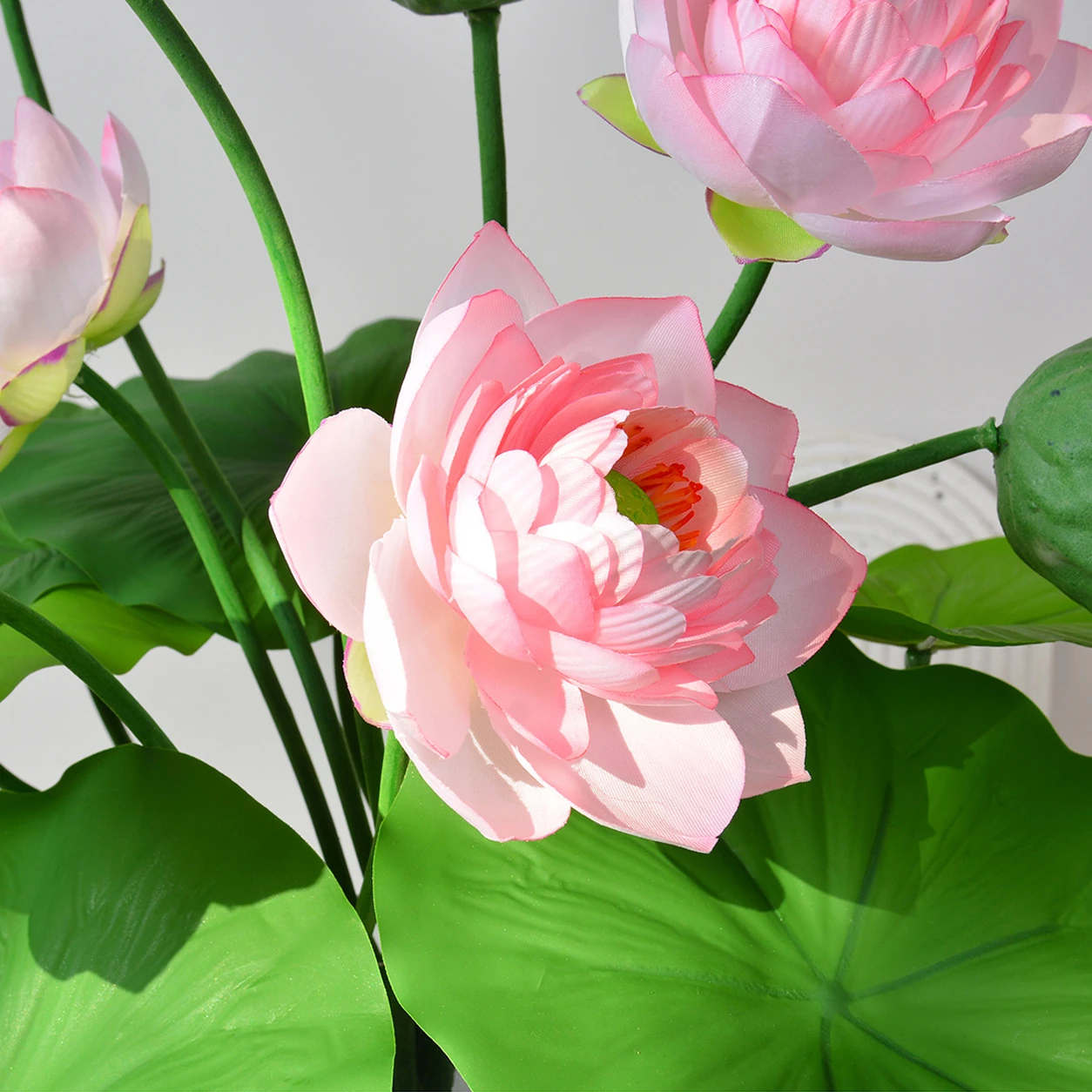 Close-up of pink artificial lotus flower bush