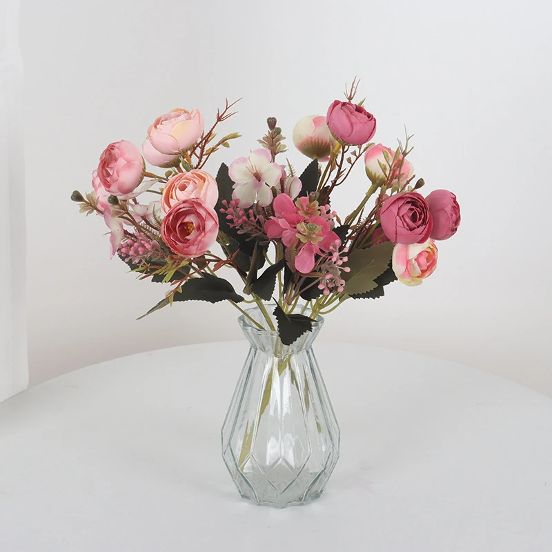Application display of pink artificial mixed rose flower bouquet