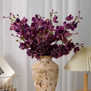 Application display of burgundy artificial mokara orchid stem