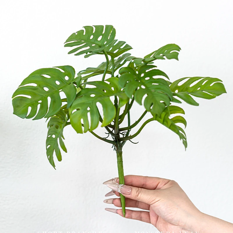 Scale view of artificial monstera leaf bush