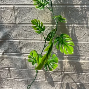 Close-up of leaves on artificial monstera garland