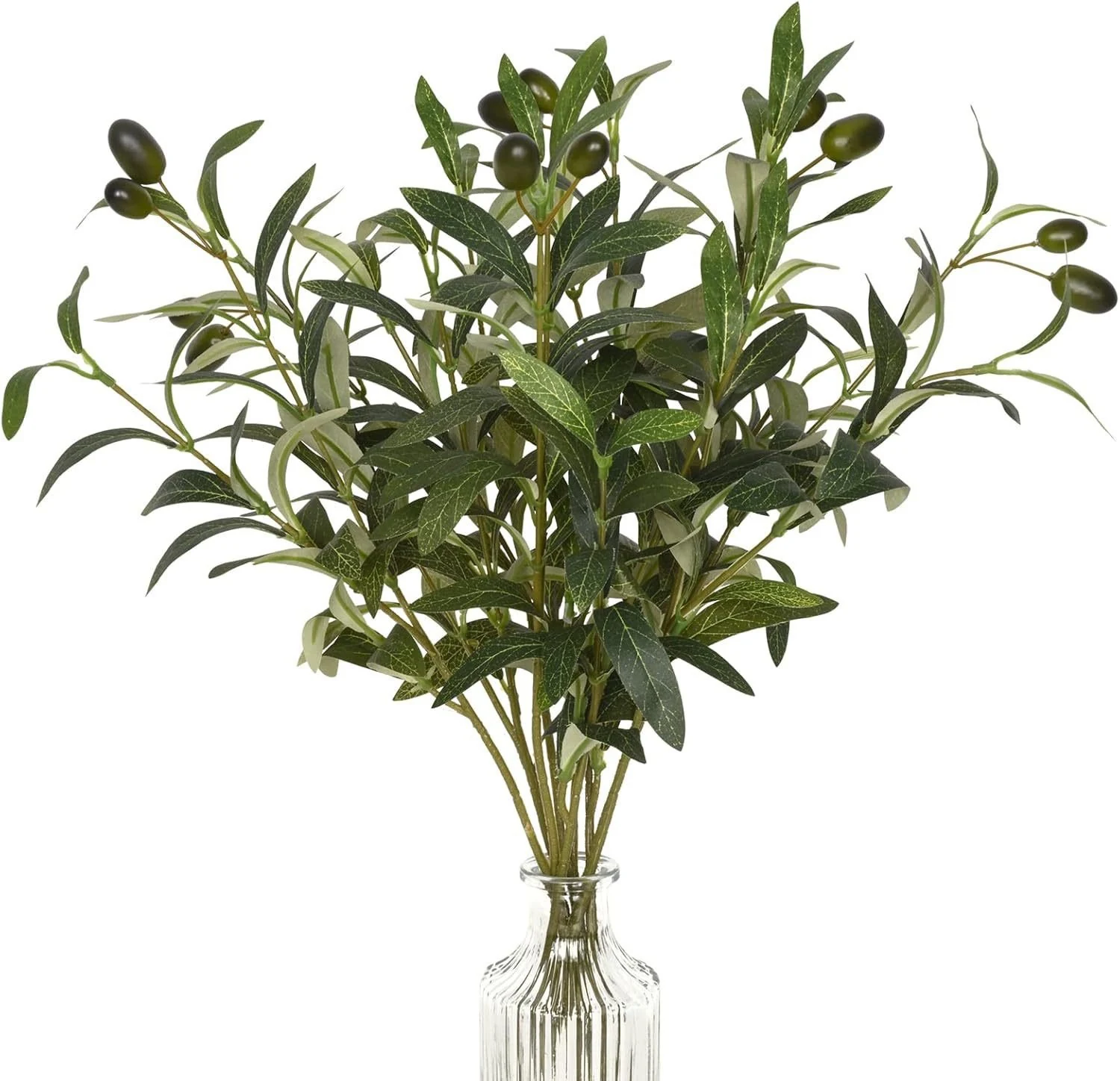 Artificial olive branches arranged in a clear glass vase