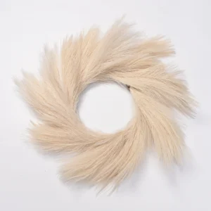 Cream artificial pampas grass wreath on a white background