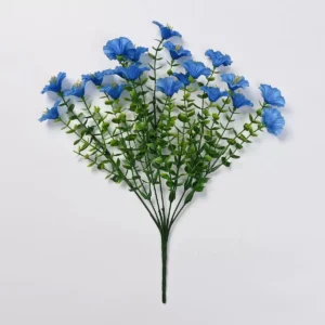 Blue artificial petunia flower bush on a white background