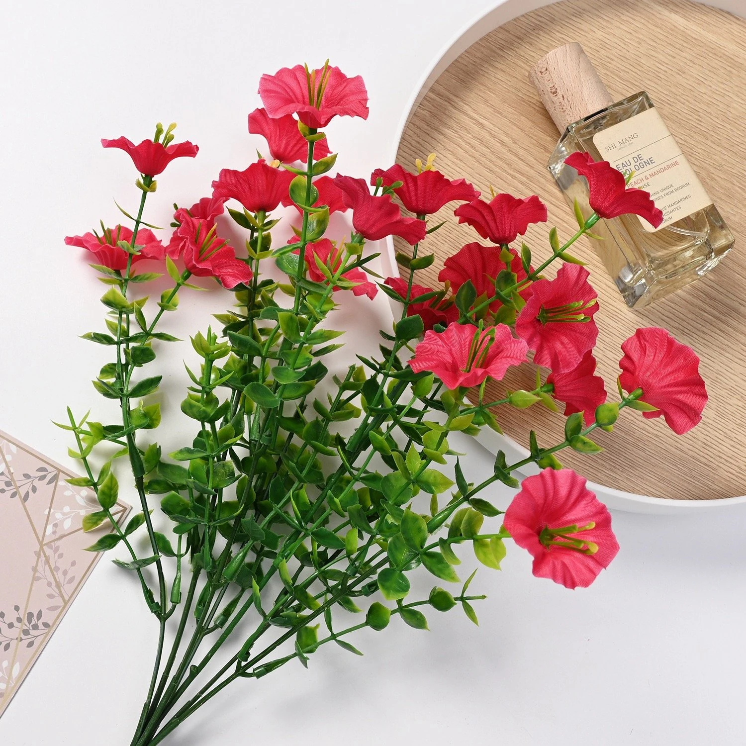 Hot pink artificial petunia flower bush in a tabletop display