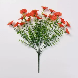 Orange artificial petunia flower bush on a white background