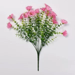 Pink artificial petunia flower bush on a white background