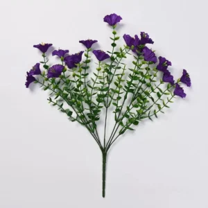 Purple artificial petunia flower bush on a white background