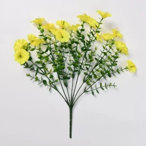 Yellow artificial petunia flower bush on a white background