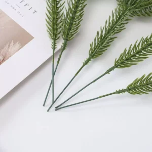 Artificial pine needle picks showing flexible insertion stems