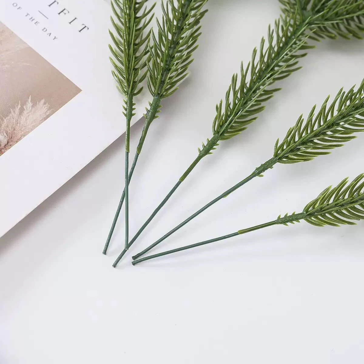 Artificial pine needle picks showing flexible insertion stems
