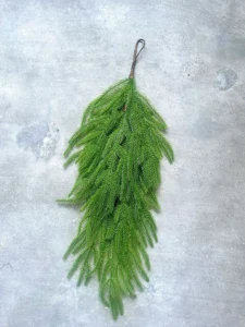 Artificial pine swag displayed vertically by its hanging loop