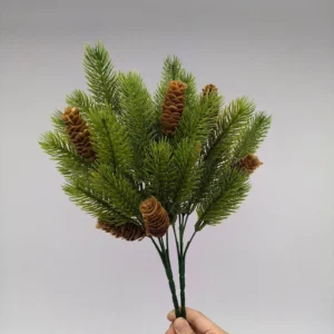 Hand-held front view of artificial pinecone evergreen bush