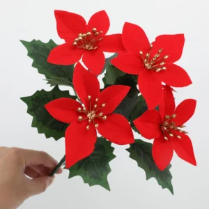 Close-up of red artificial poinsettia flowers with silver accents