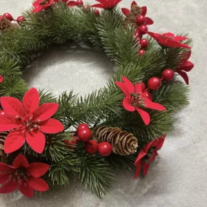 Close-up of detail artificial poinsettia pine christmas wreath
