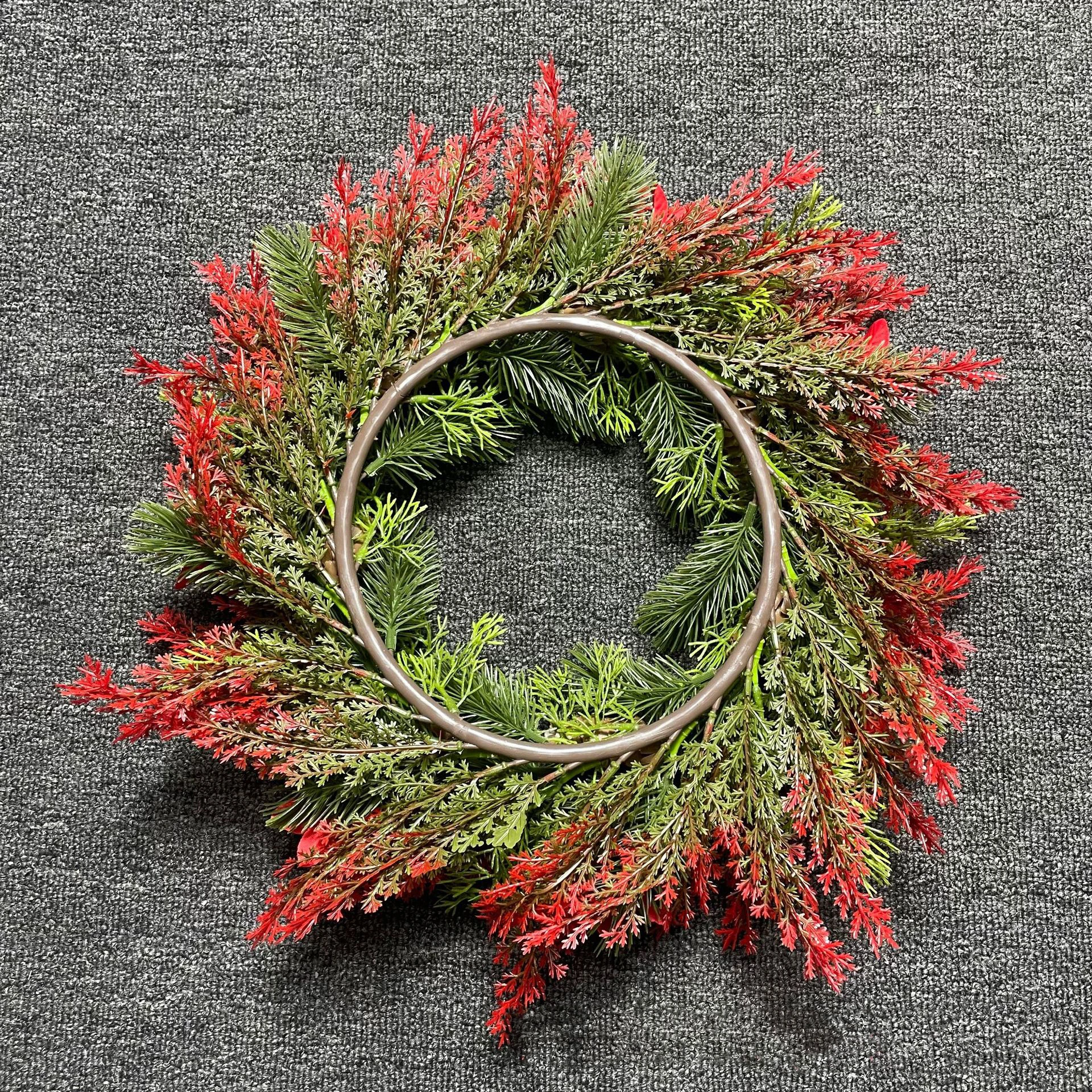 Close-up of artificial poinsettia pinecone christmas wreath