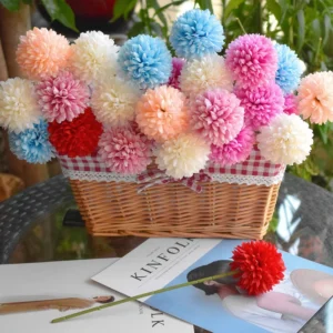 Available colors for artificial pompon mum stems in a decorative basket display