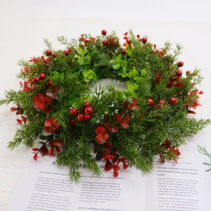 Artificial Red Berry Mixed Greenery Wreath arranged for decorative display