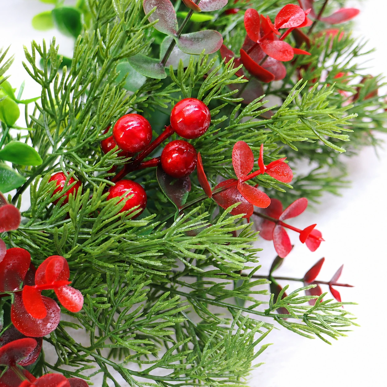 Close-up of artificial Red Berry Mixed Greenery Wreath