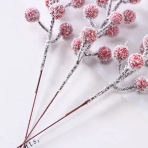 Close-up of snow-dusted flocking on artificial berry pick stems