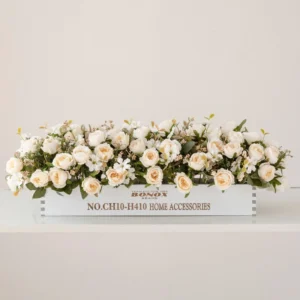 white artificial rose blossom flower box centerpiece