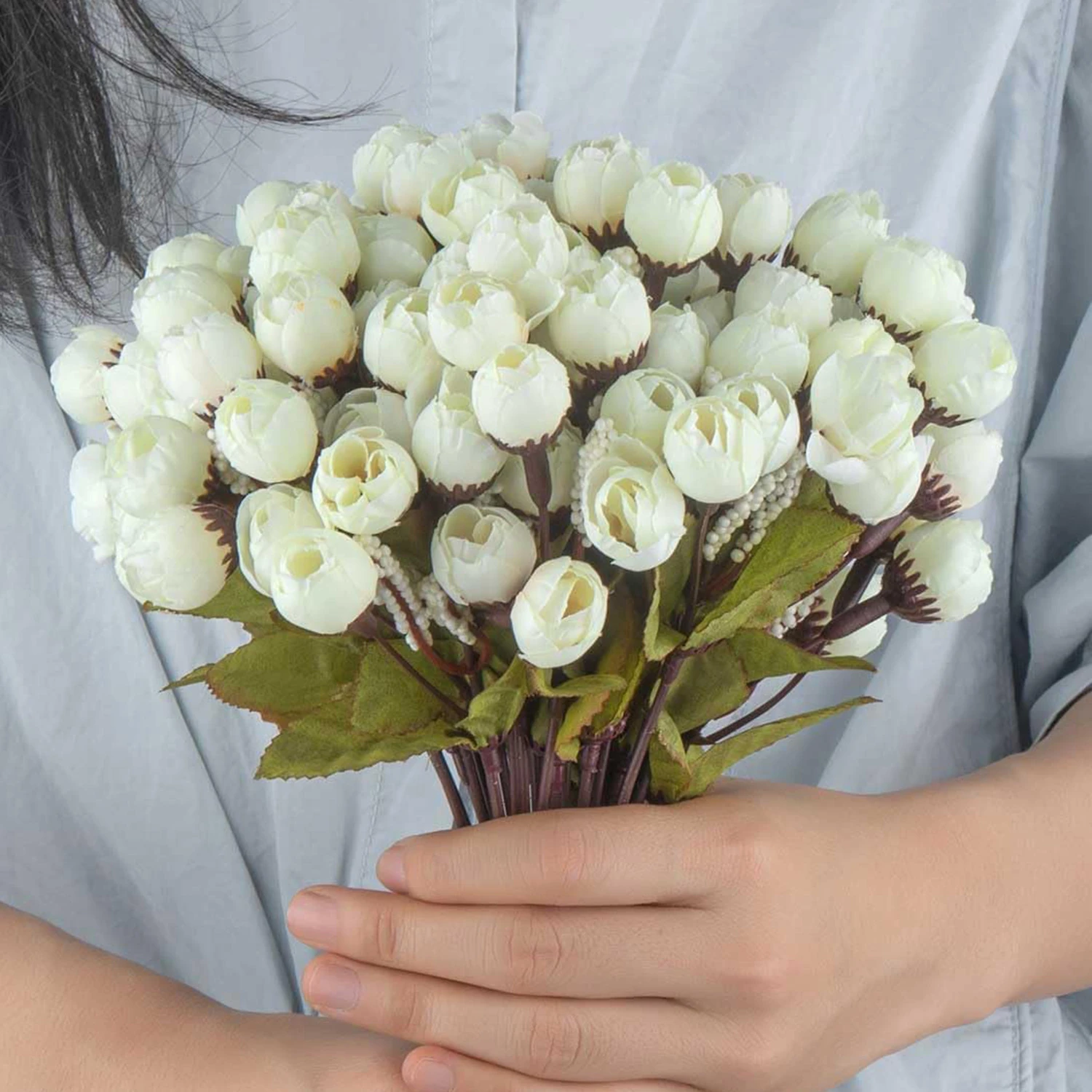 White artificial Rose Bud Bouquet arranged for decorative display