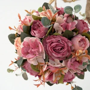 Close-up of deep pink artificial rose hydrangea flower kissing ball