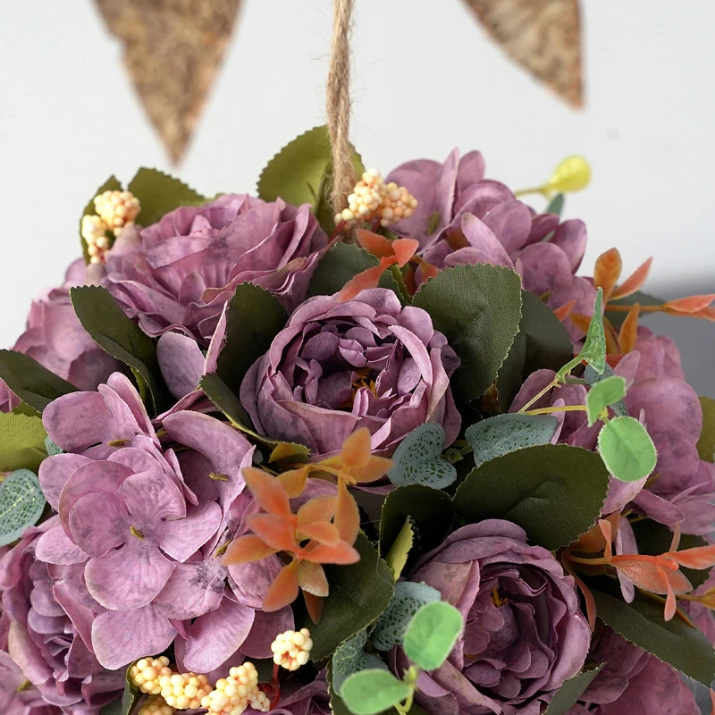 Close-up of purple artificial rose hydrangea flower kissing ball