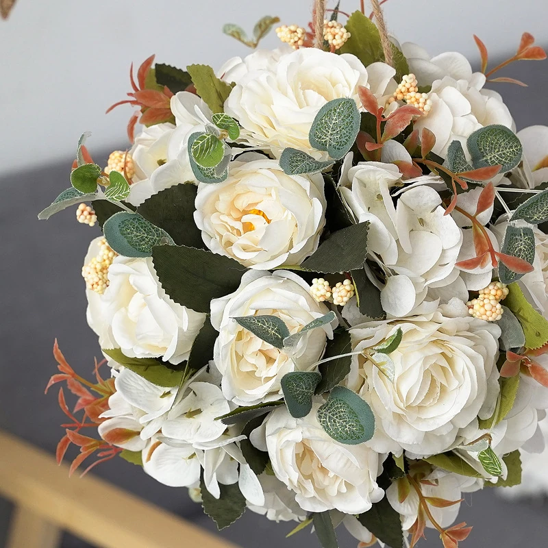 Close-up of white artificial rose hydrangea flower kissing ball