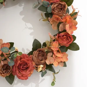Close-up of autumn-color artificial roses and hydrangea flowers