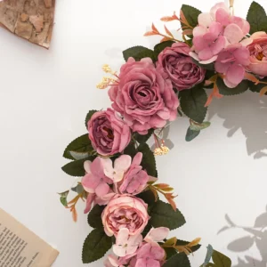Close-up of dark pink artificial roses and hydrangea flowers