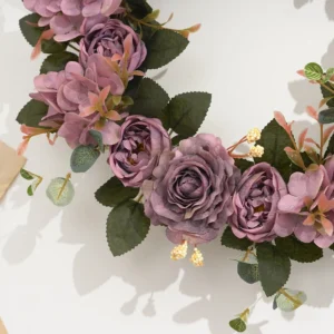 Close-up of purple artificial roses and hydrangea flowers