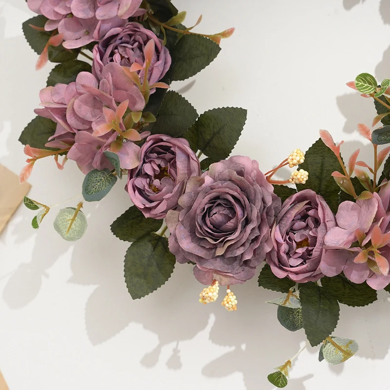 Close-up of purple artificial roses and hydrangea flowers