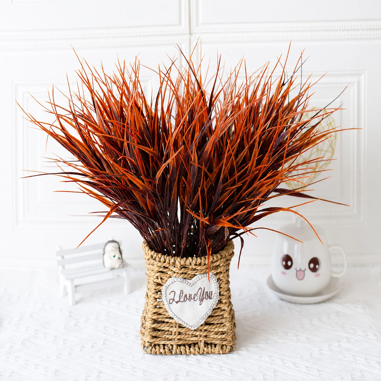 Autumn red artificial grass bushes arranged in a vase