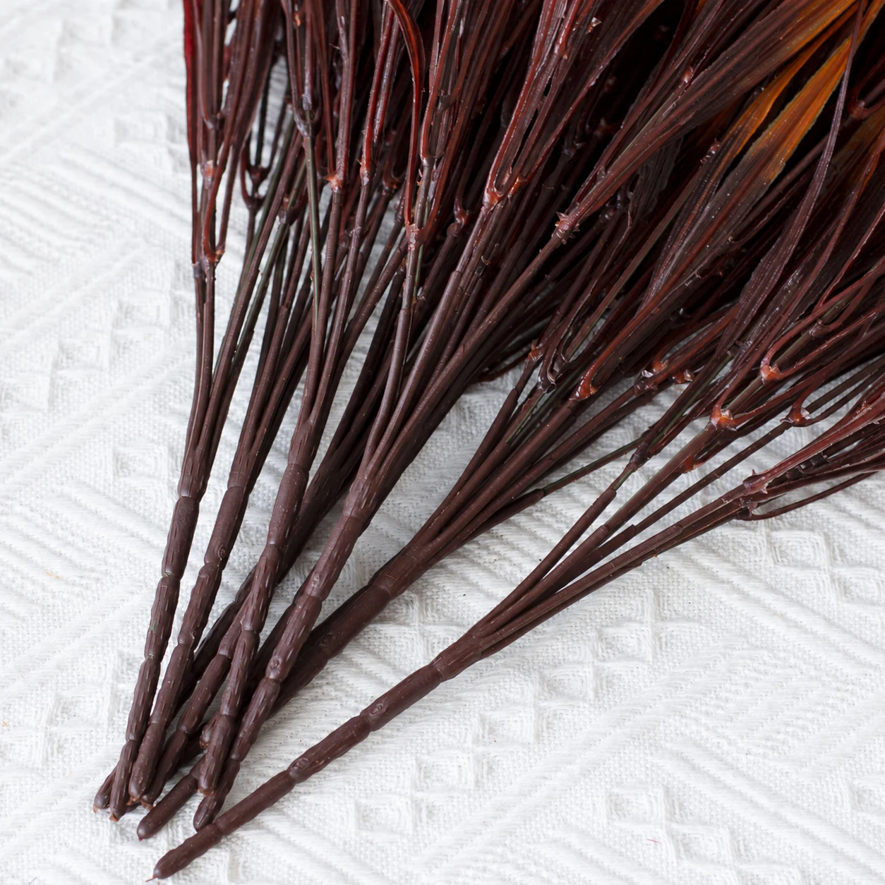 Stem detail of artificial seven-branch autumn grass bush