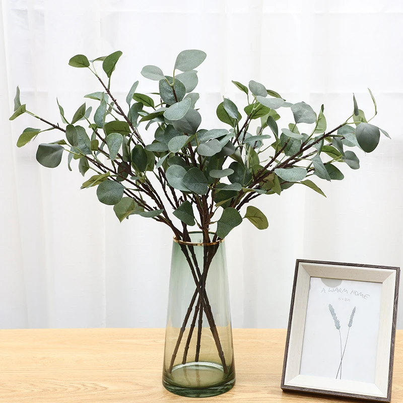 Artificial Silver Dollar Eucalyptus Branch displayed for vase