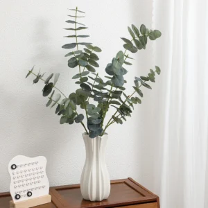 Artificial Silver Dollar Eucalyptus Spray displayed for vase