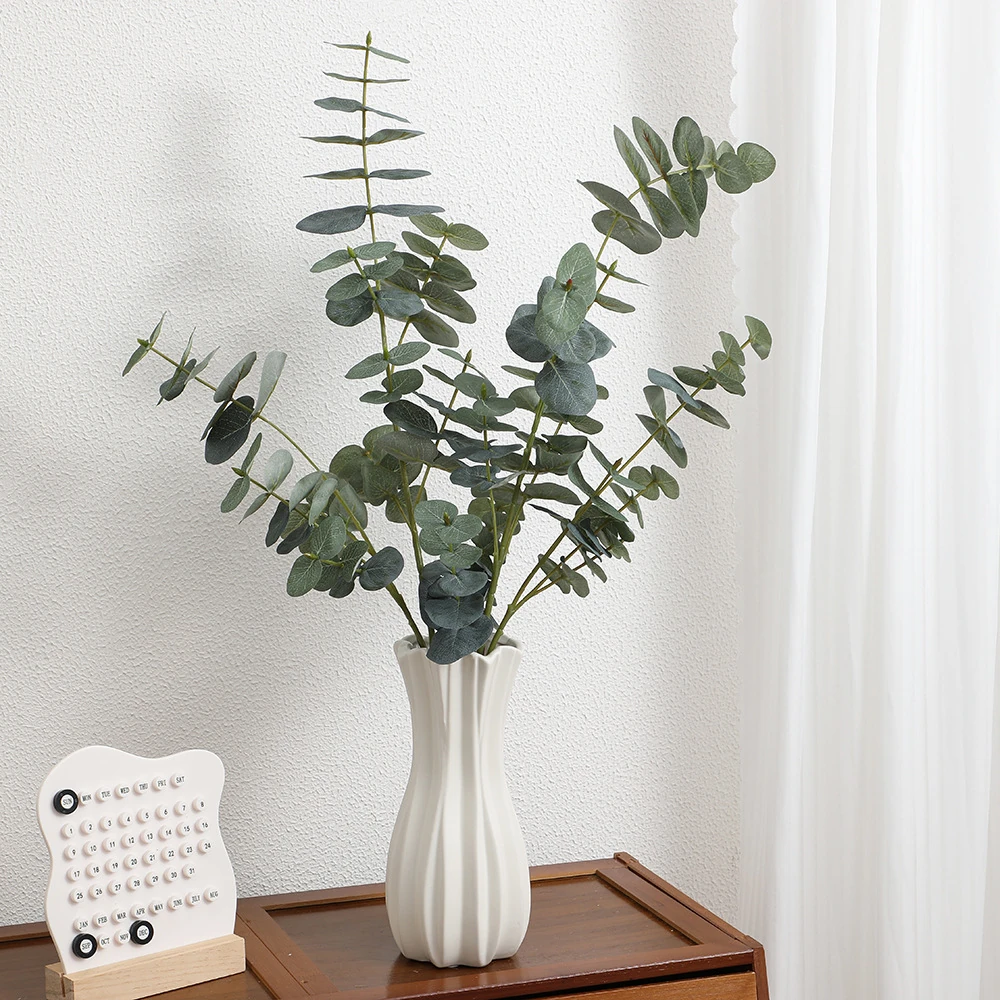 Artificial Silver Dollar Eucalyptus Spray displayed for vase