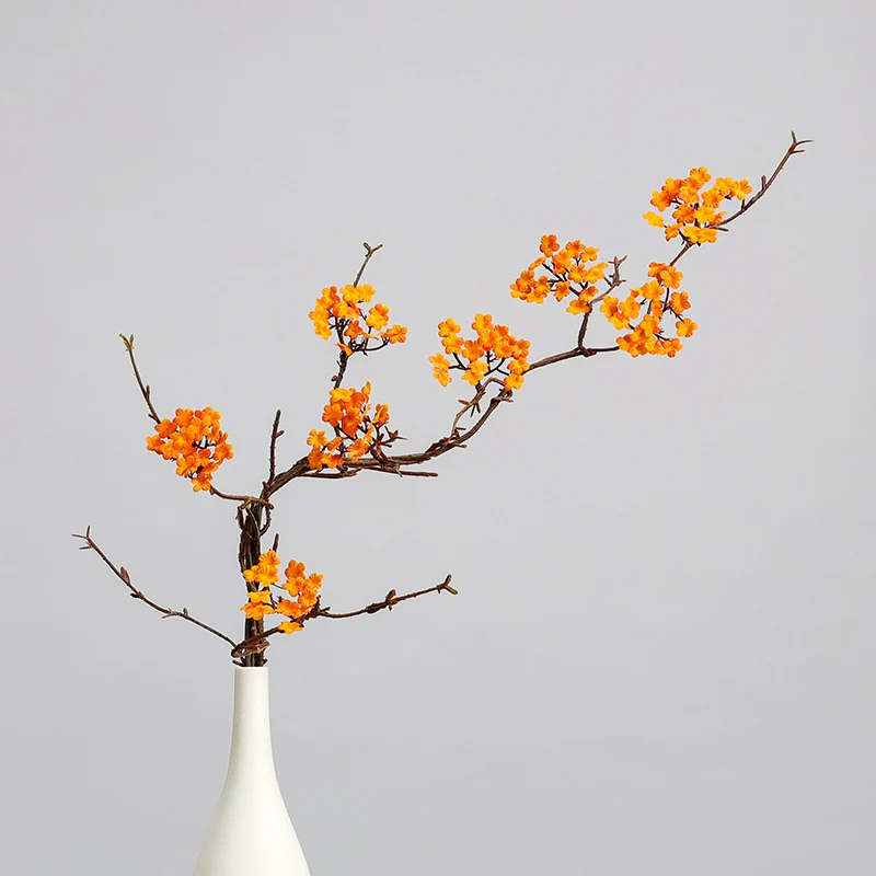 Artificial Small Blossom Branch shown in orange vase application